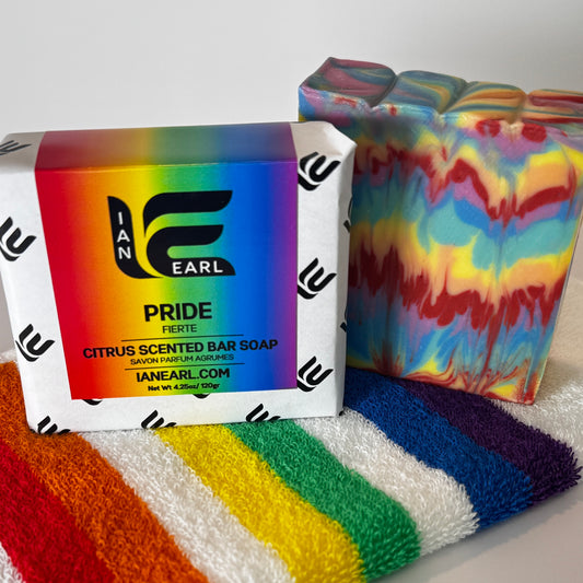 Pride Bar Soap bar and packaging on a pride cloth